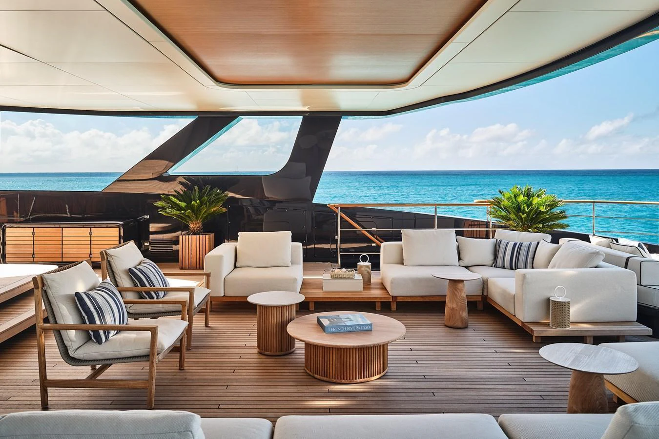 The aft deck features a luxurious seating area with a stunning ocean view. aboard SEAWOLF X Yacht for Sale