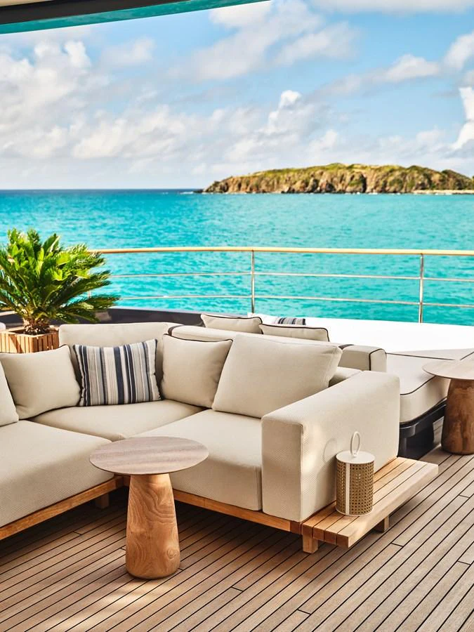 The aft deck offers a luxurious seating area with stunning ocean views. aboard SEAWOLF X Yacht for Sale