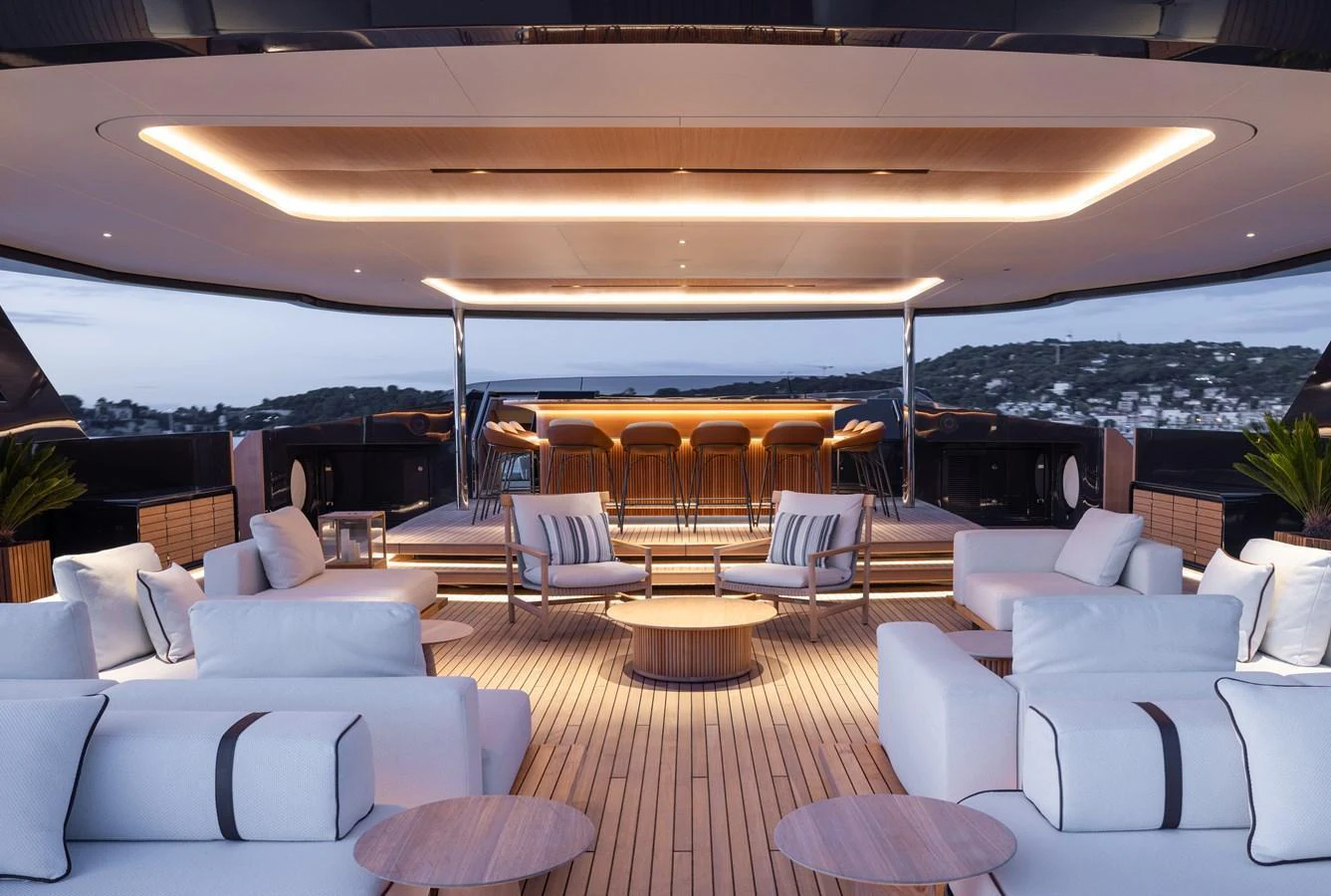 The sundeck features luxurious seating and a stylish bar area, perfect for relaxation and entertainment. aboard SEAWOLF X Yacht for Sale