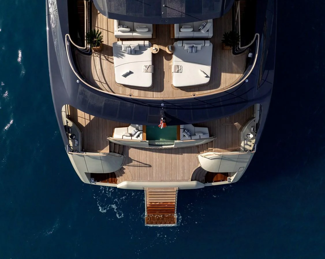 The aft deck features luxurious lounging areas with direct access to the water. aboard SEAWOLF X Yacht for Sale