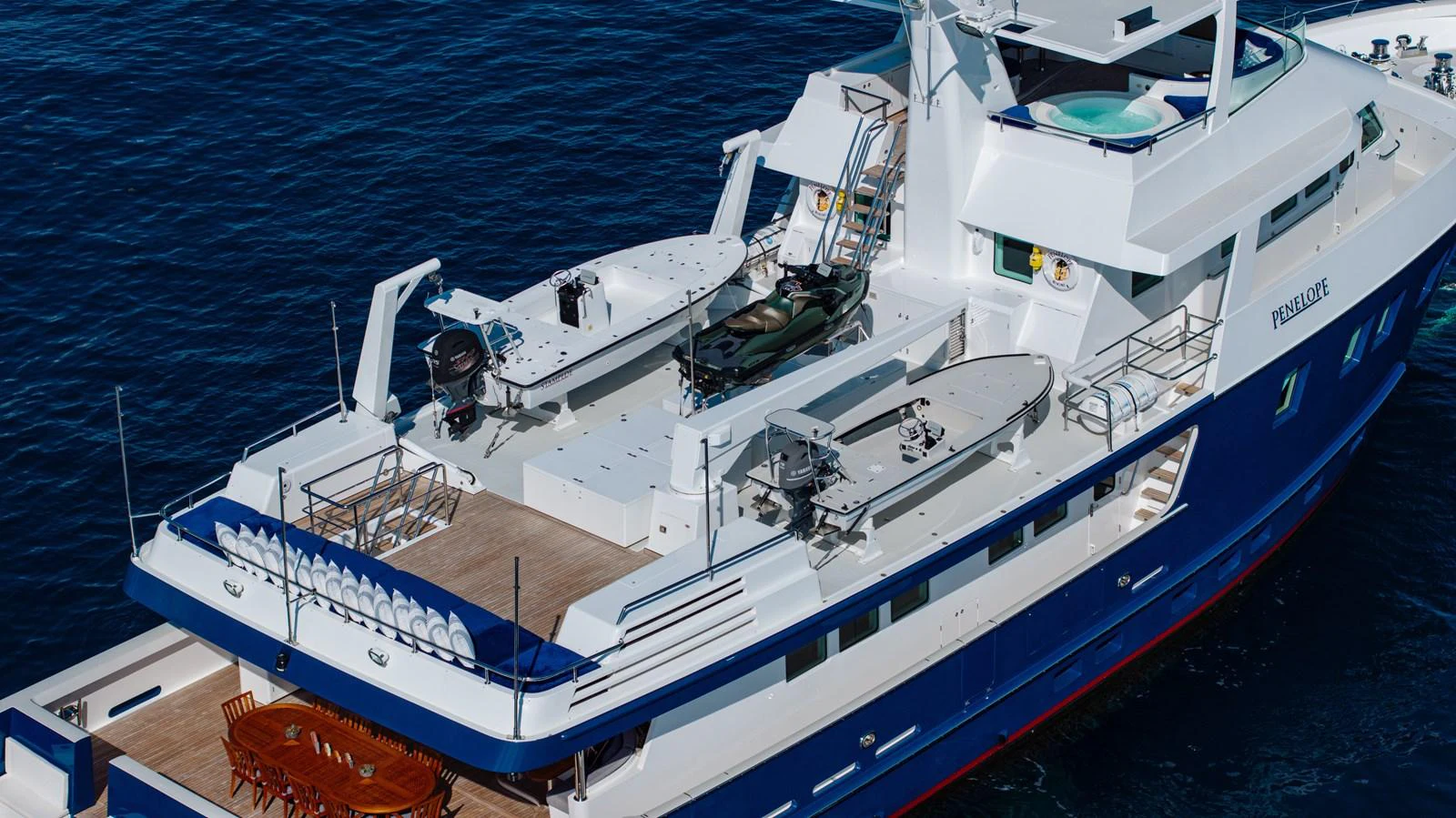a large white boat aboard STAMPEDE Yacht for Sale