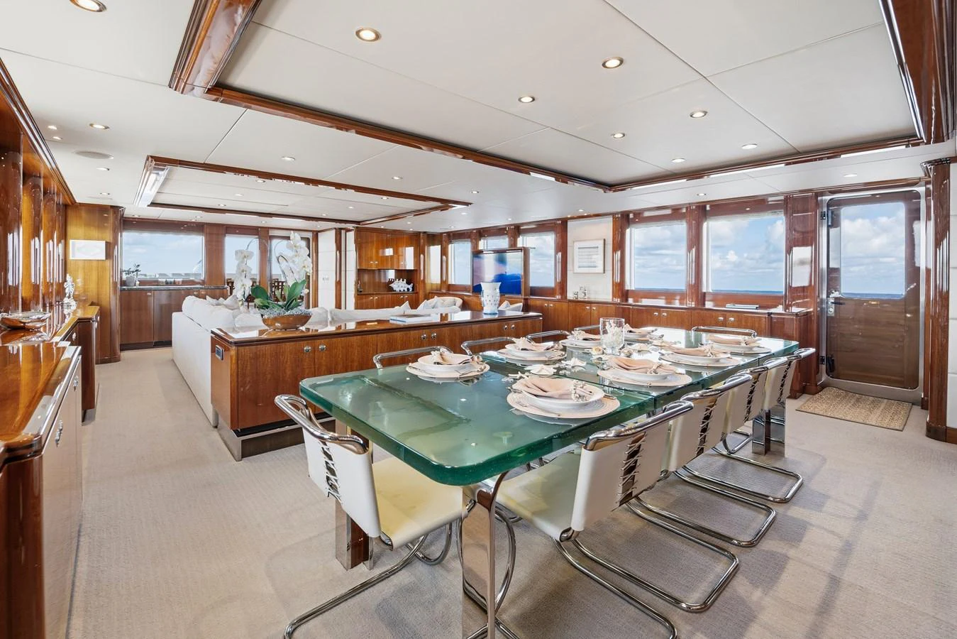 a large kitchen with a table and chairs aboard STAMPEDE Yacht for Sale