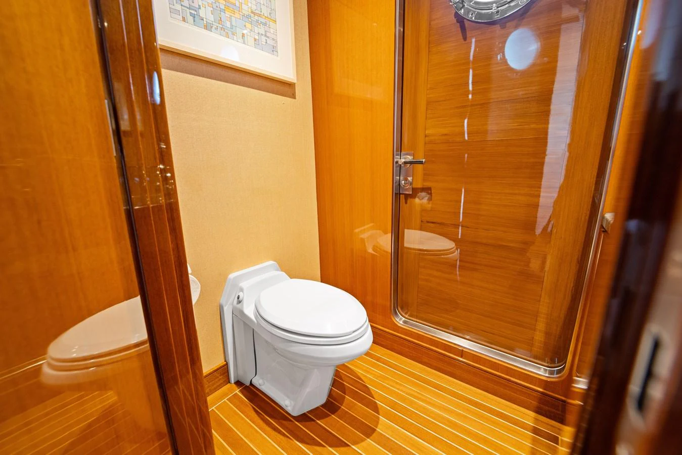 a bathroom with a glass shower door aboard STAMPEDE Yacht for Sale