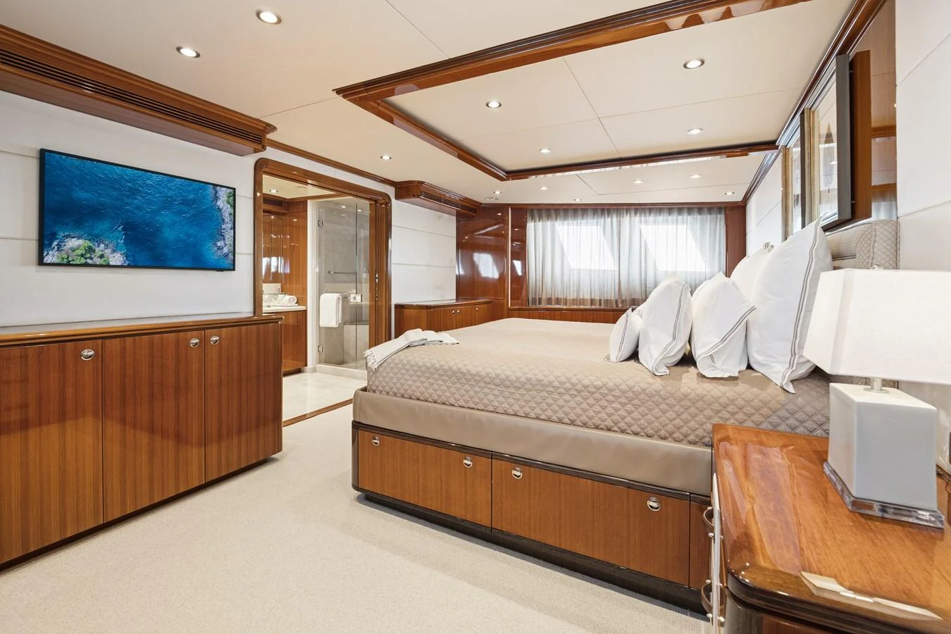 a large bed in a hotel room aboard STAMPEDE Yacht for Sale