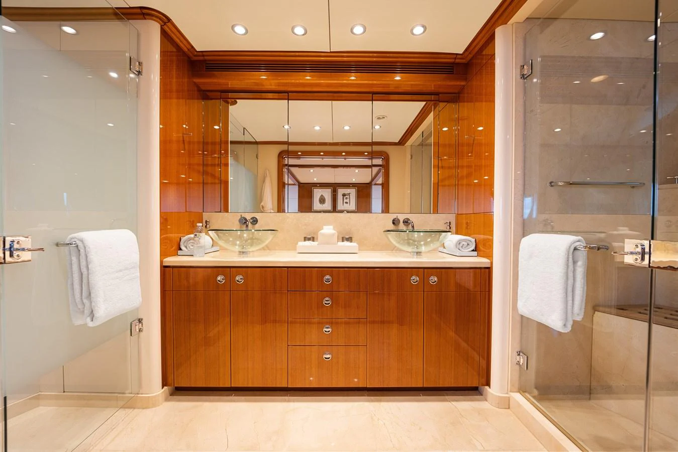a bathroom with a large mirror aboard STAMPEDE Yacht for Sale