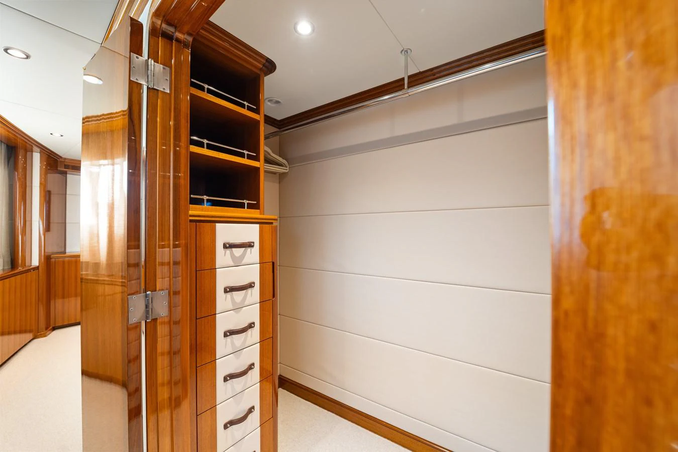 a room with a closet and shelves aboard STAMPEDE Yacht for Sale