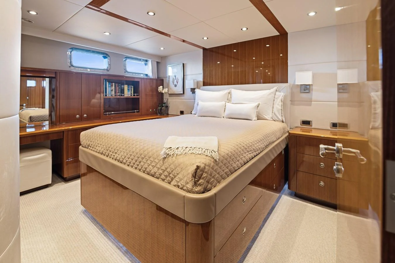 a large bed in a room aboard STAMPEDE Yacht for Sale