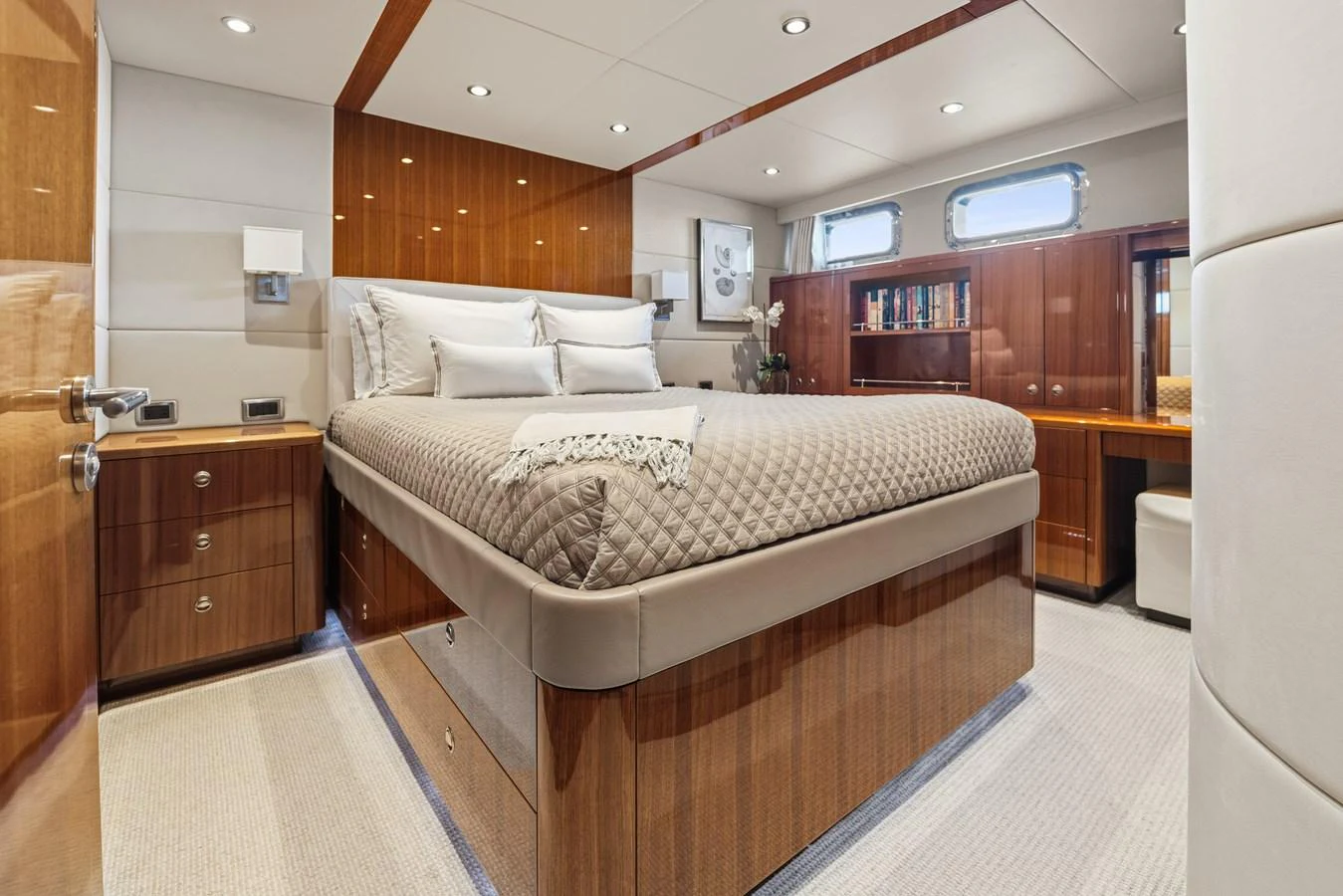 a room with a bed and a desk aboard STAMPEDE Yacht for Sale