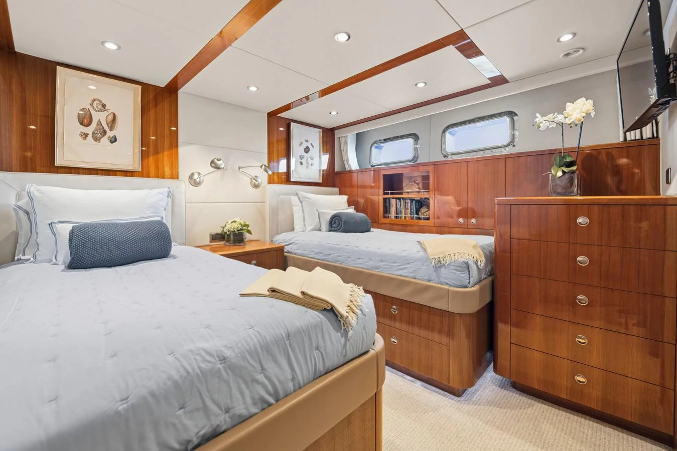 a room with wooden cabinets and a bed aboard STAMPEDE Yacht for Sale