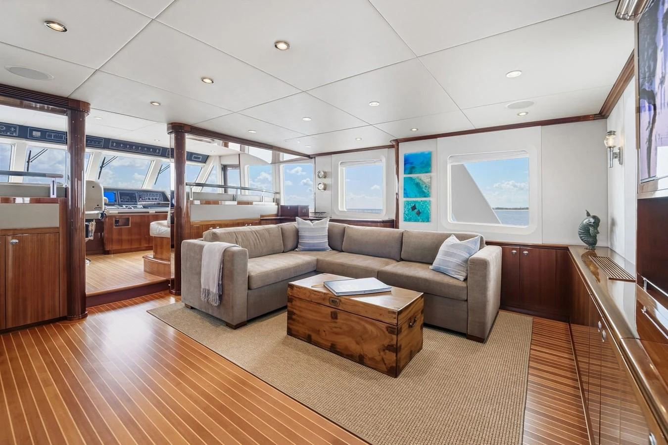 a living room with a wood floor aboard STAMPEDE Yacht for Sale