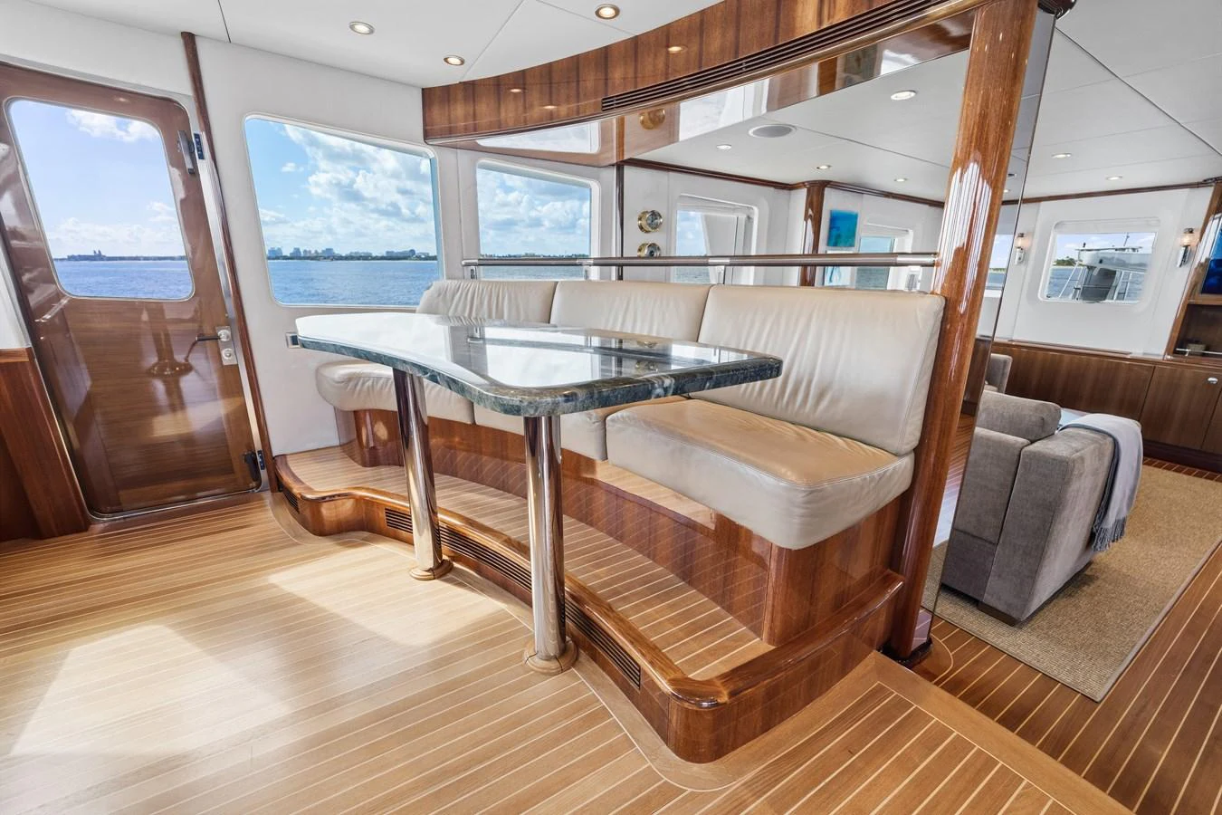 a room with a table and chairs aboard STAMPEDE Yacht for Sale