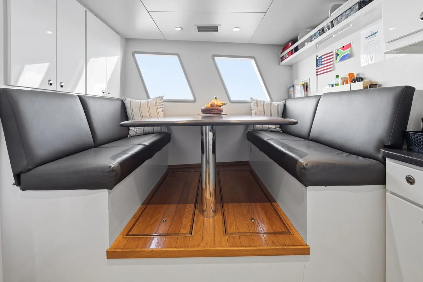 a living room with a couch and a table aboard STAMPEDE Yacht for Sale