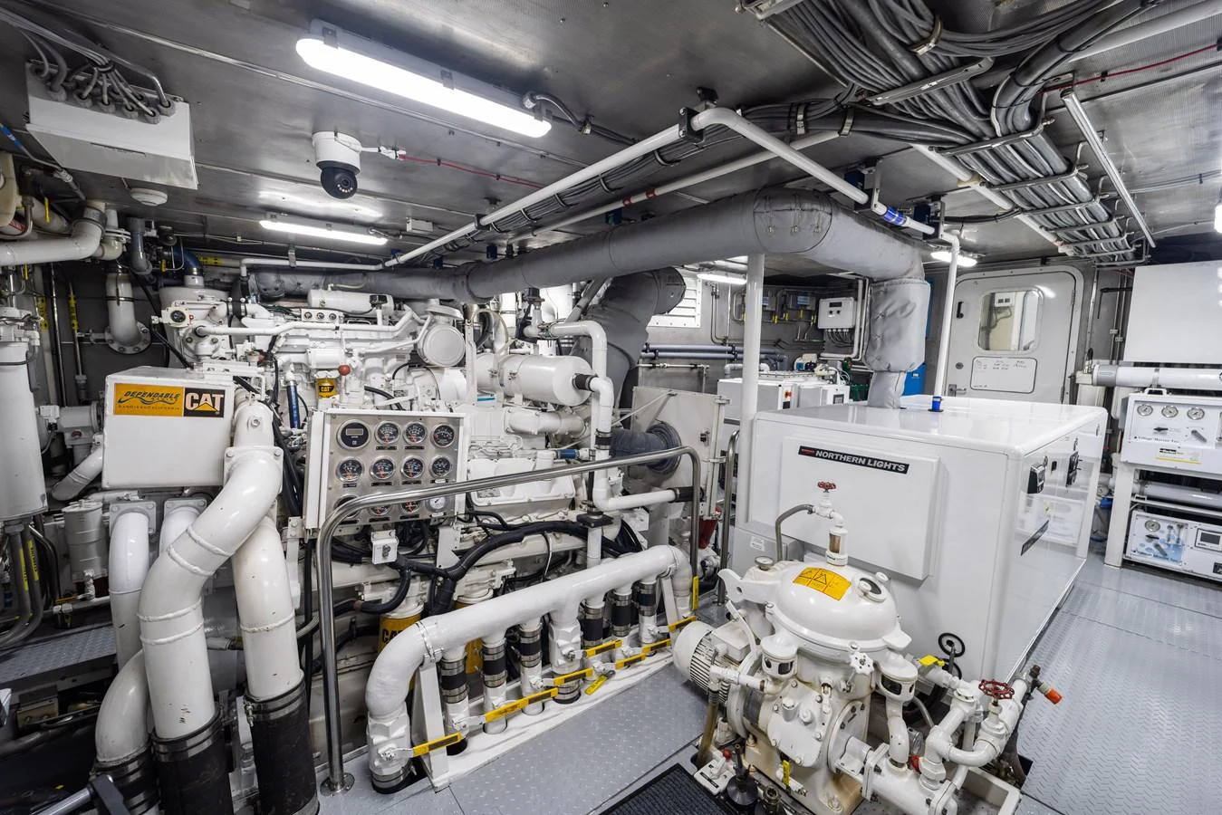 a room with several white machines aboard STAMPEDE Yacht for Sale