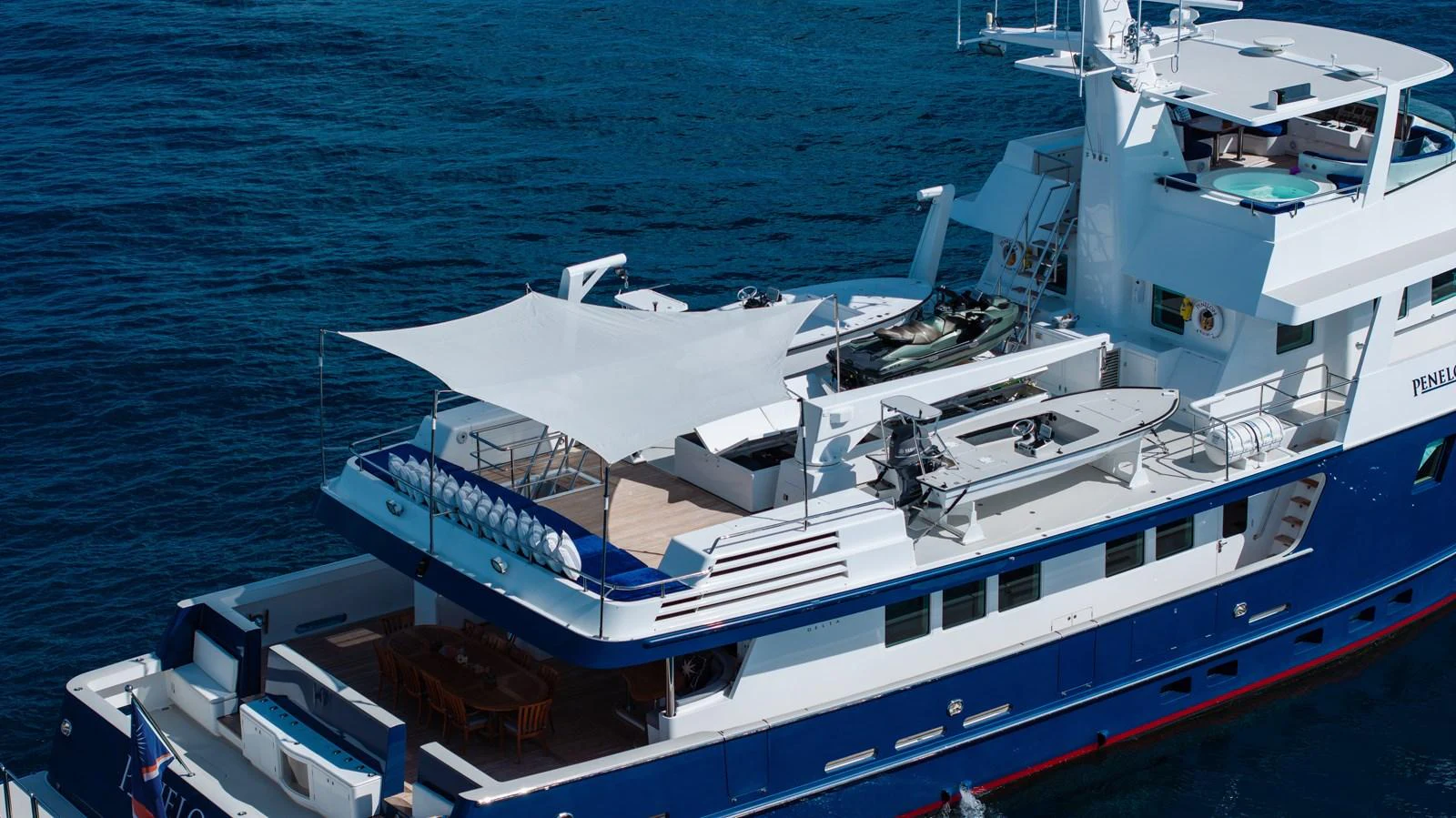 a large boat in the water aboard STAMPEDE Yacht for Sale