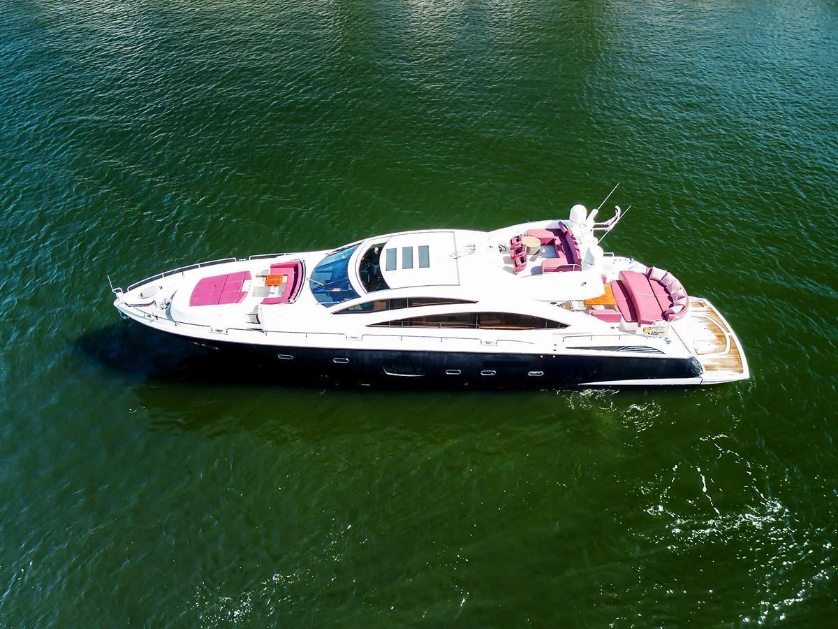 A sleek and modern yacht glides gracefully on calm waters, showcasing its luxurious design and spacious deck areas. aboard GBXSK84PRD13 Yacht for Sale