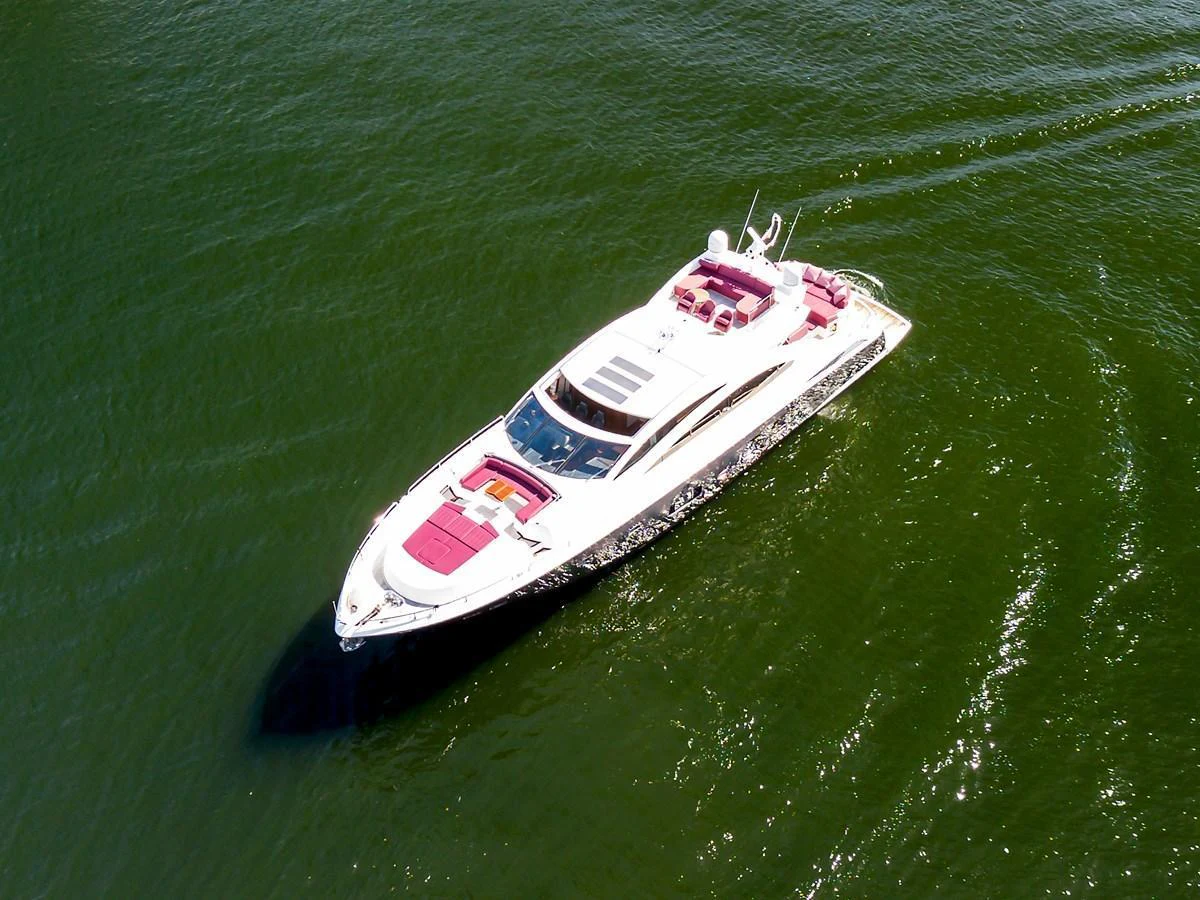 A sleek and modern yacht glides gracefully on calm waters, showcasing its luxurious design and spacious deck areas. aboard GBXSK84PRD13 Yacht for Sale