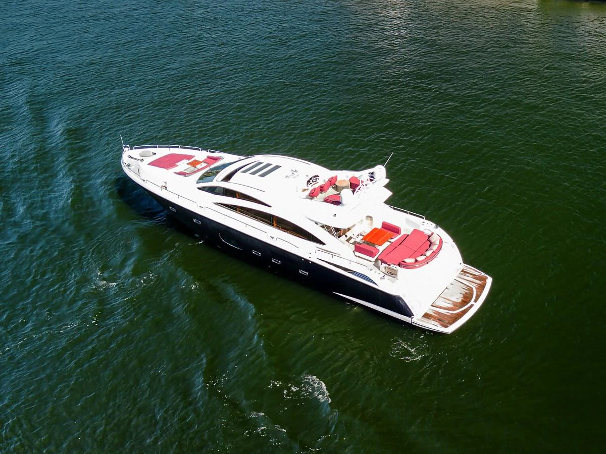 A sleek and modern yacht glides gracefully on the water, showcasing its luxurious design and spacious deck areas. aboard GBXSK84PRD13 Yacht for Sale