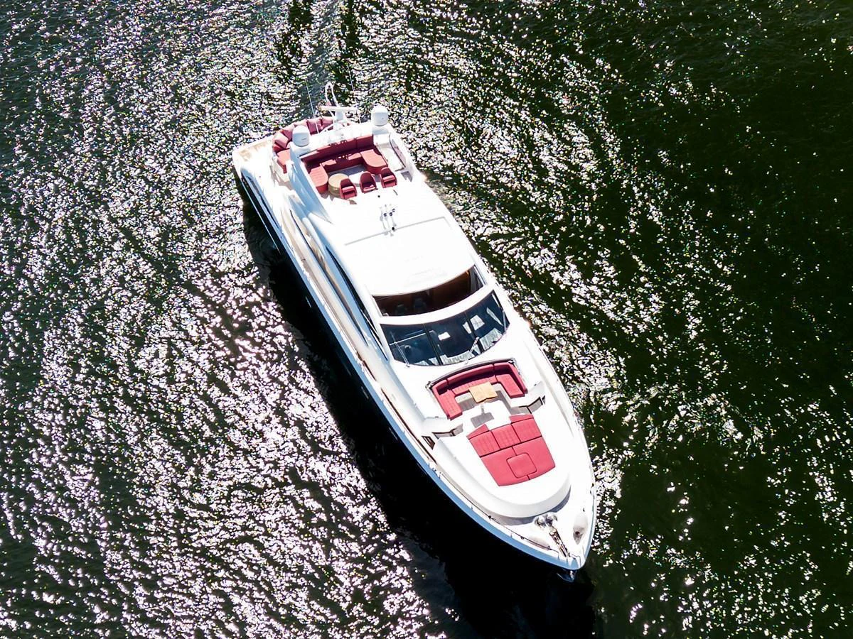 A sleek yacht glides gracefully over shimmering waters, showcasing its elegant design and luxurious amenities. aboard GBXSK84PRD13 Yacht for Sale