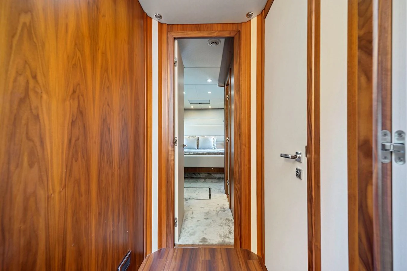 A luxurious hallway leading to a well-appointed stateroom. aboard GBXSK84PRD13 Yacht for Sale