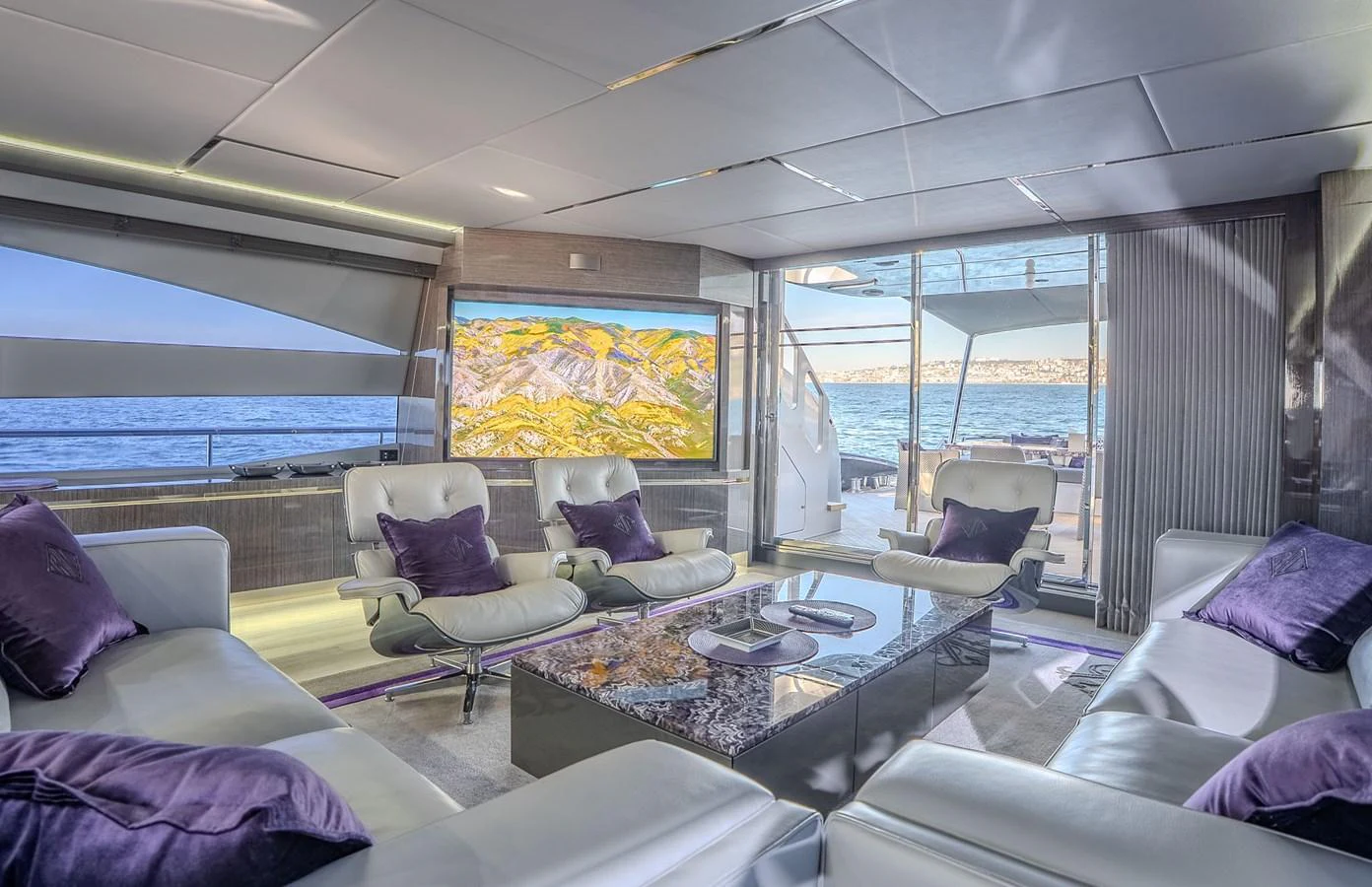 The salon offers a luxurious and comfortable seating area with a stunning view of the sea. aboard SPECTRE Yacht for Sale