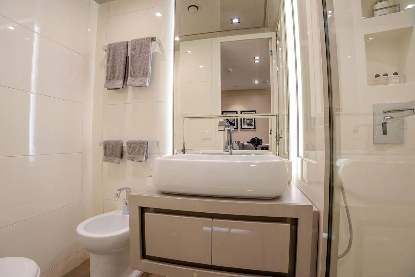 The yacht's bathroom features modern fixtures and a sleek design. aboard SPECTRE Yacht for Sale
