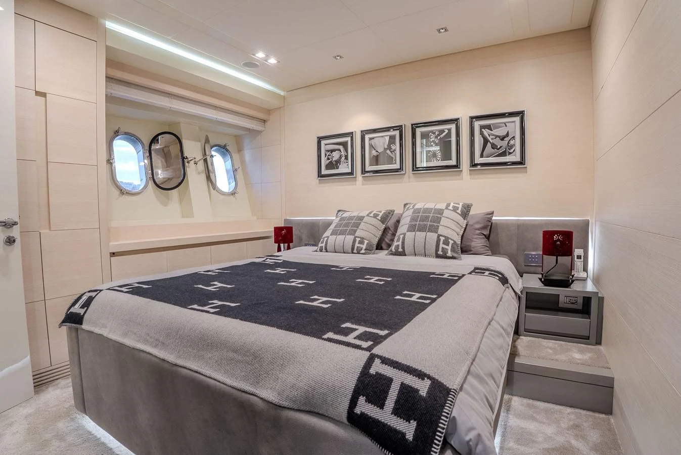 The stateroom offers a cozy and elegant retreat with plush bedding and stylish decor. aboard SPECTRE Yacht for Sale