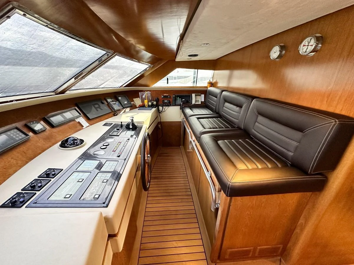 The helm station features a sleek design with modern navigation equipment and comfortable seating. aboard GALINI Yacht for Sale