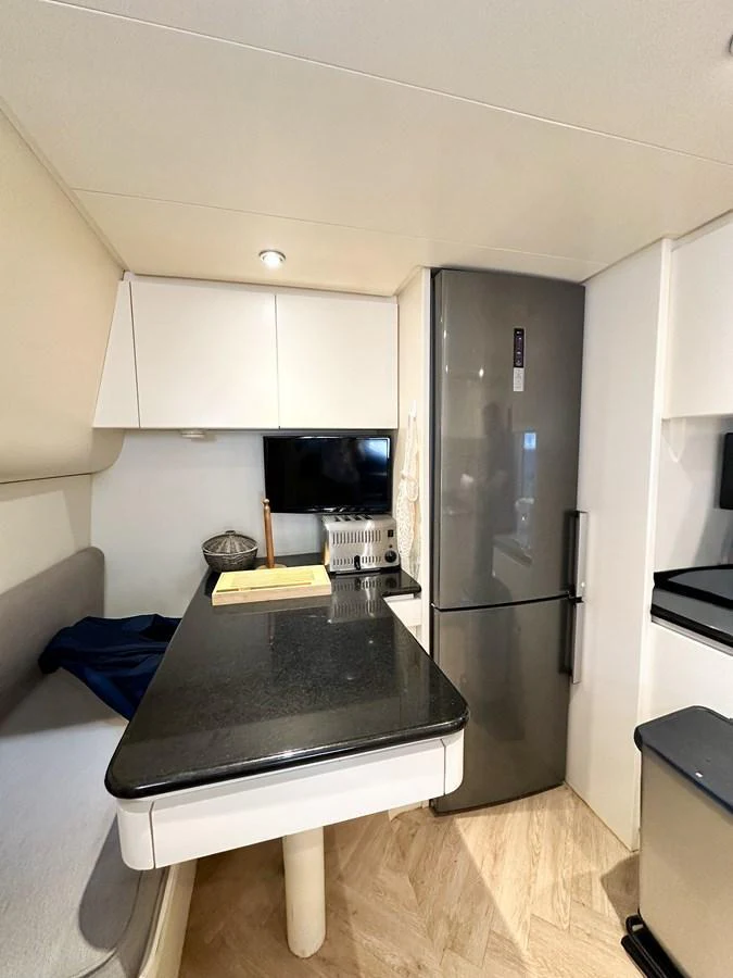The yacht's galley features modern appliances and a sleek design. aboard GALINI Yacht for Sale