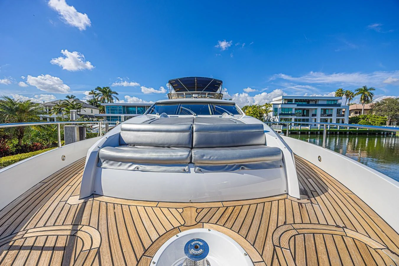 The yacht's bow features a spacious sunpad area with luxurious seating and a stunning view of the surroundings. aboard BIG CHUBBY XL Yacht for Sale