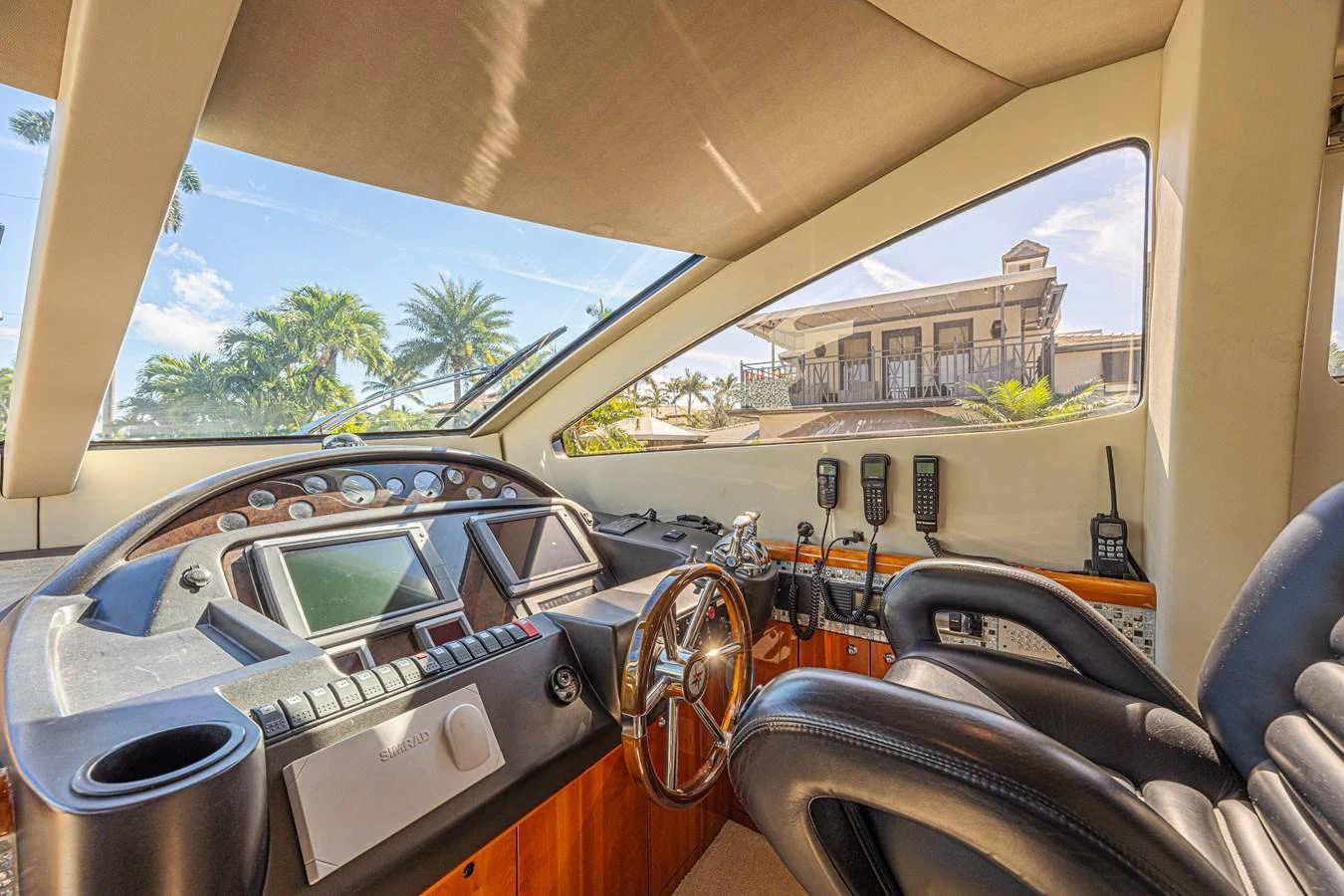 The helm station offers a commanding view with luxurious seating and state-of-the-art navigation equipment. aboard BIG CHUBBY XL Yacht for Sale