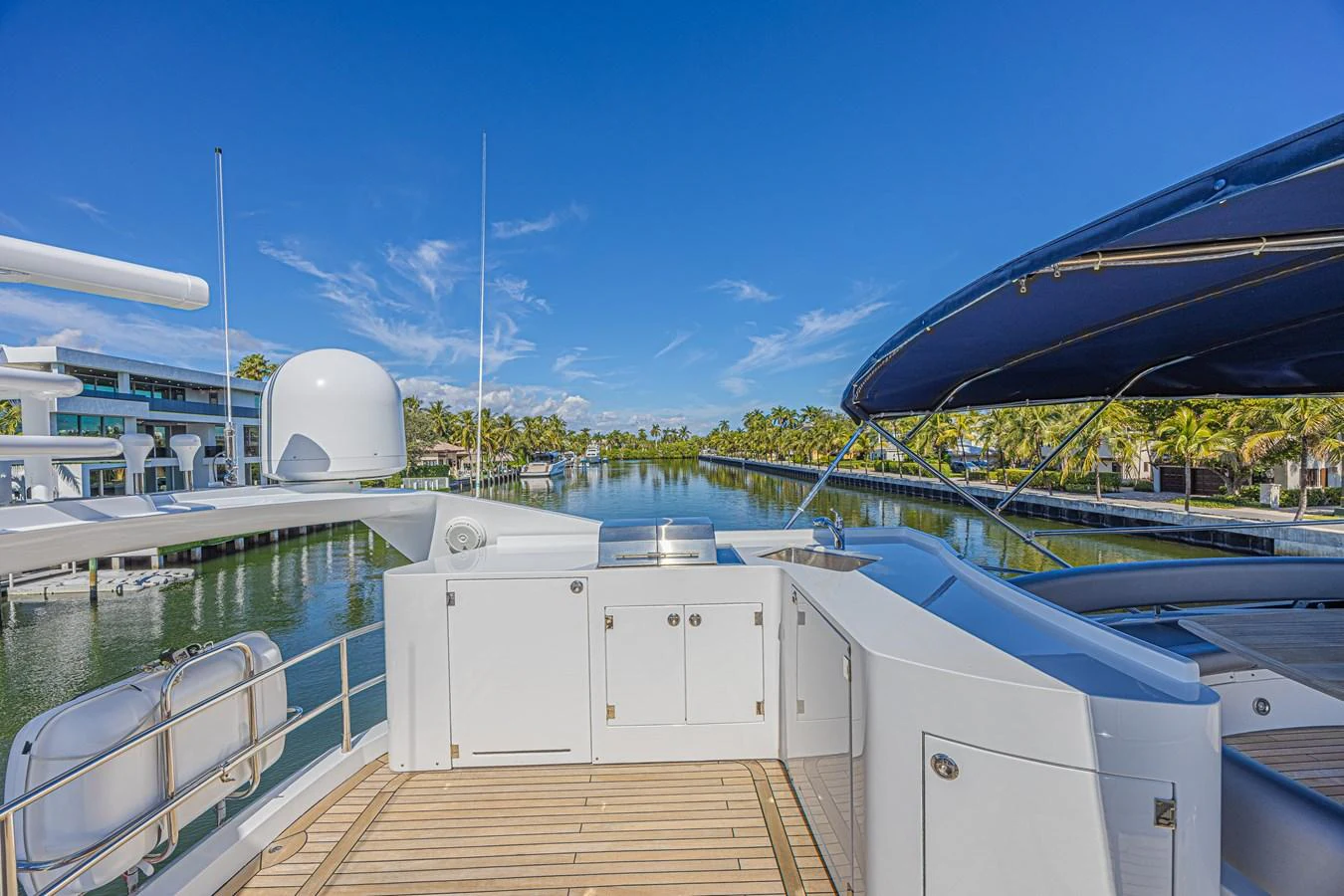 The aft deck offers a spacious and inviting area with a beautiful view of the waterway. aboard BIG CHUBBY XL Yacht for Sale