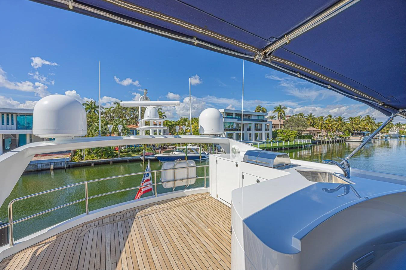 The flybridge offers a spacious and shaded area with scenic views of the surrounding waterfront properties. aboard BIG CHUBBY XL Yacht for Sale