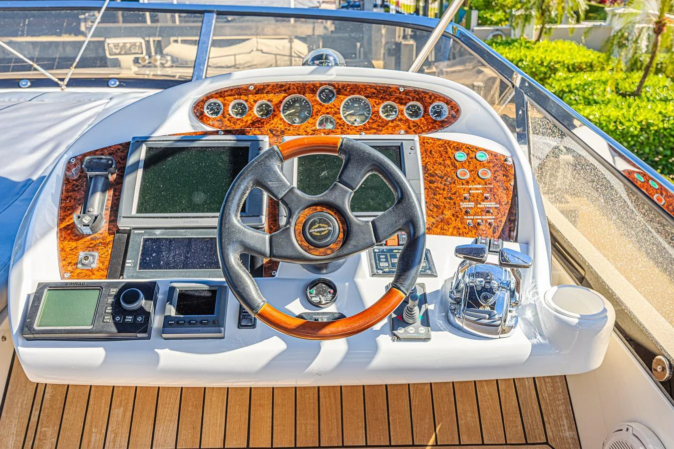 The helm station features a sophisticated array of controls and navigation instruments. aboard BIG CHUBBY XL Yacht for Sale