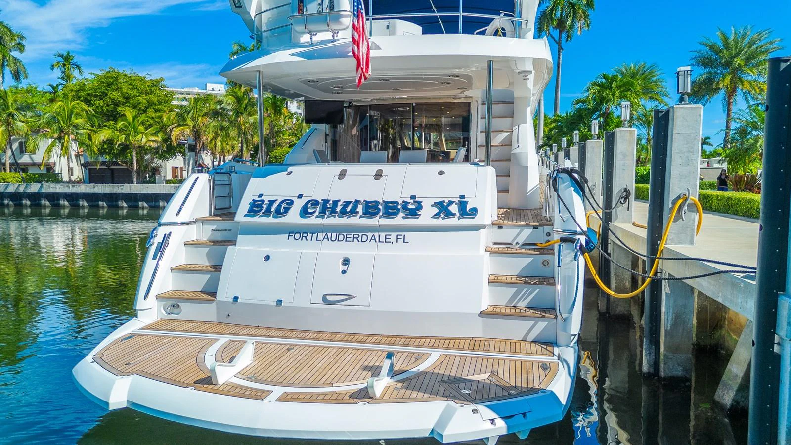 The yacht's aft deck features a spacious swim platform and elegant teak decking, perfect for waterside relaxation. aboard BIG CHUBBY XL Yacht for Sale