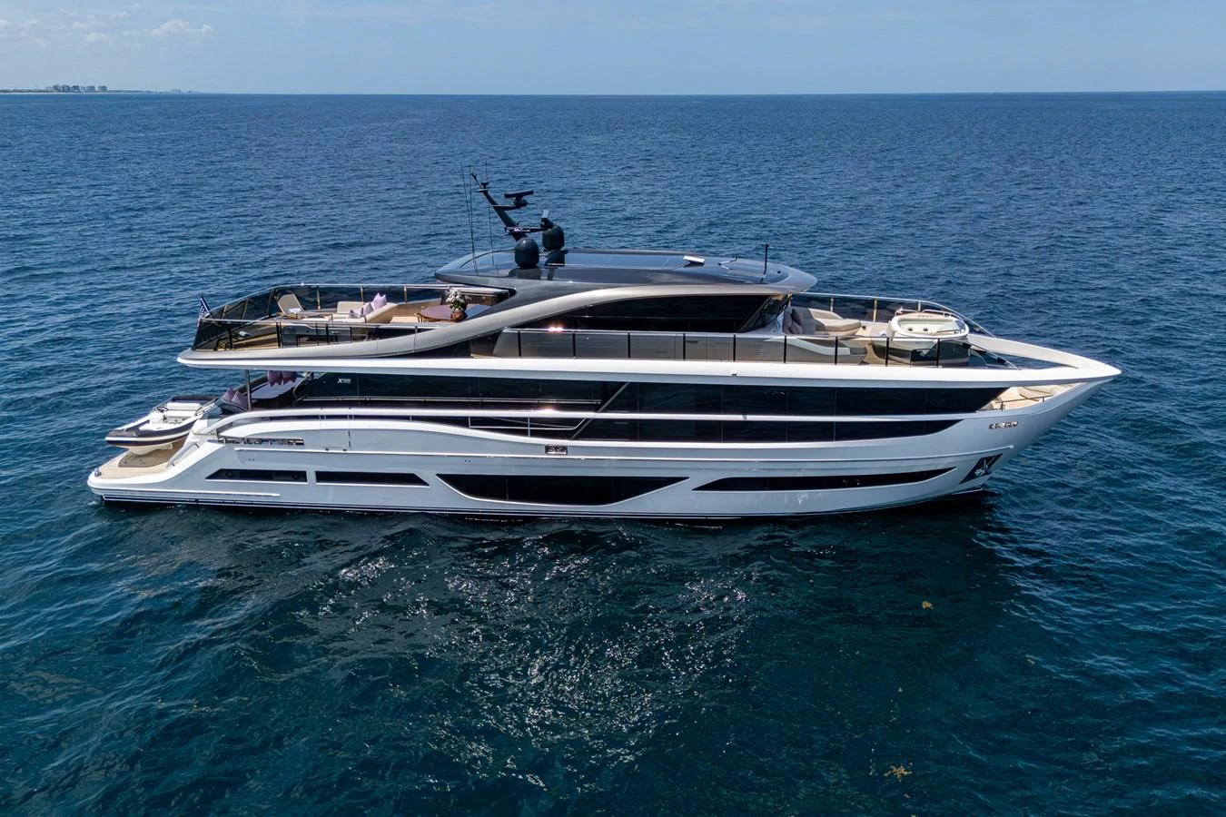 a white yacht in the ocean aboard SPLASH Yacht for Sale