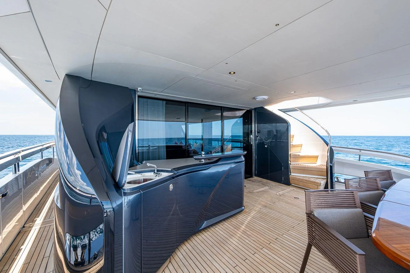 a boat with a large deck aboard SPLASH Yacht for Sale