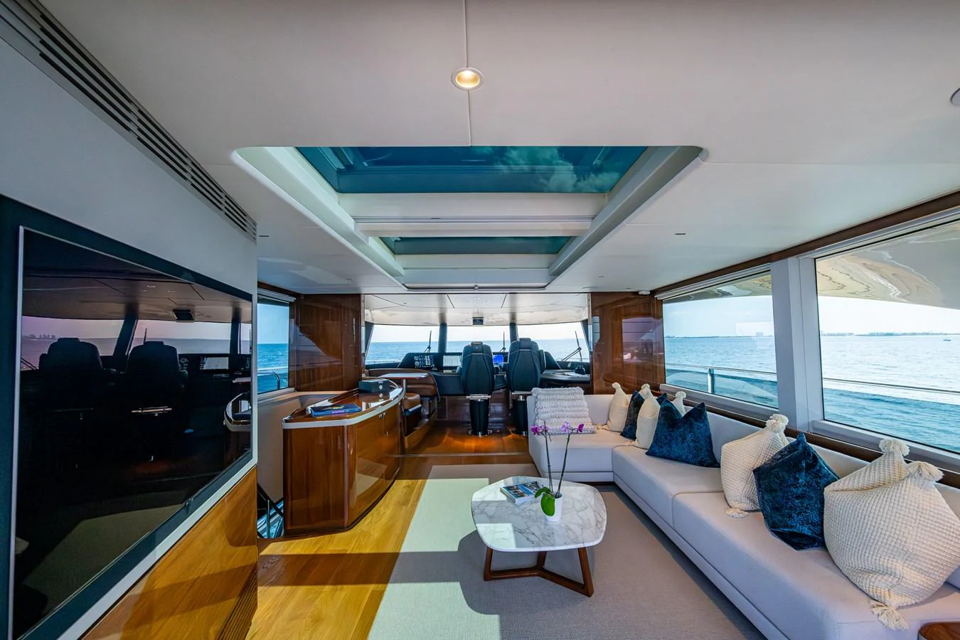 a room with a couch and a table aboard SPLASH Yacht for Sale