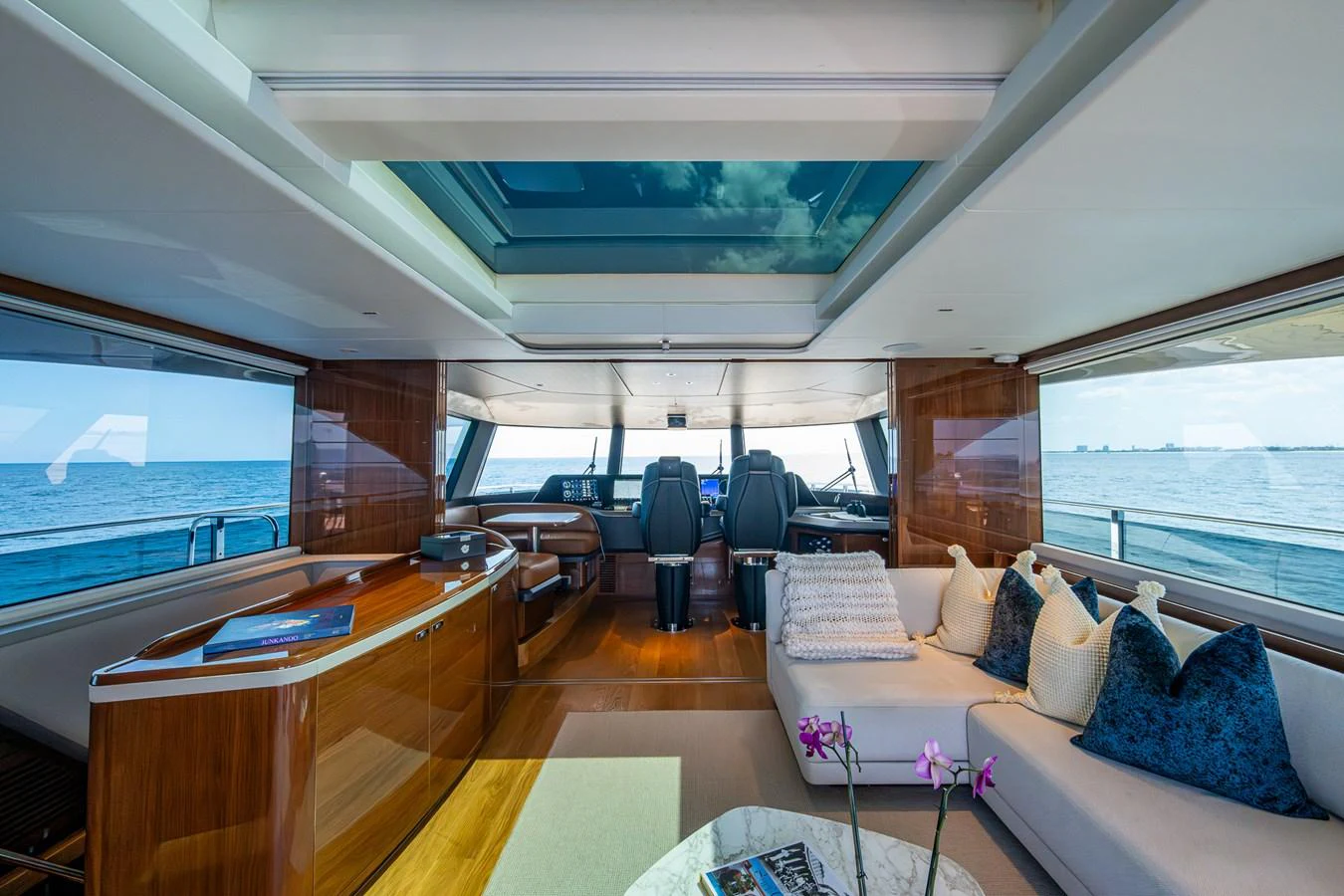 a living room with a large window aboard SPLASH Yacht for Sale