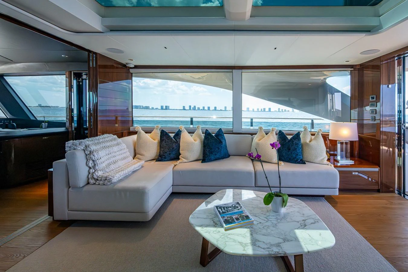 a living room with a large window aboard SPLASH Yacht for Sale