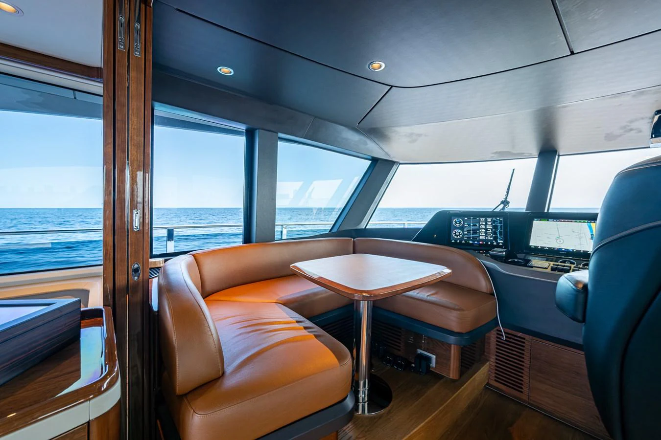 a bus with a table and chairs aboard SPLASH Yacht for Sale
