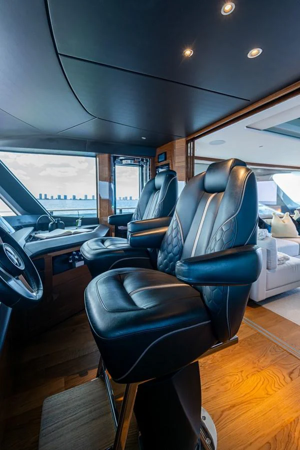 a room with a desk and chairs aboard SPLASH Yacht for Sale