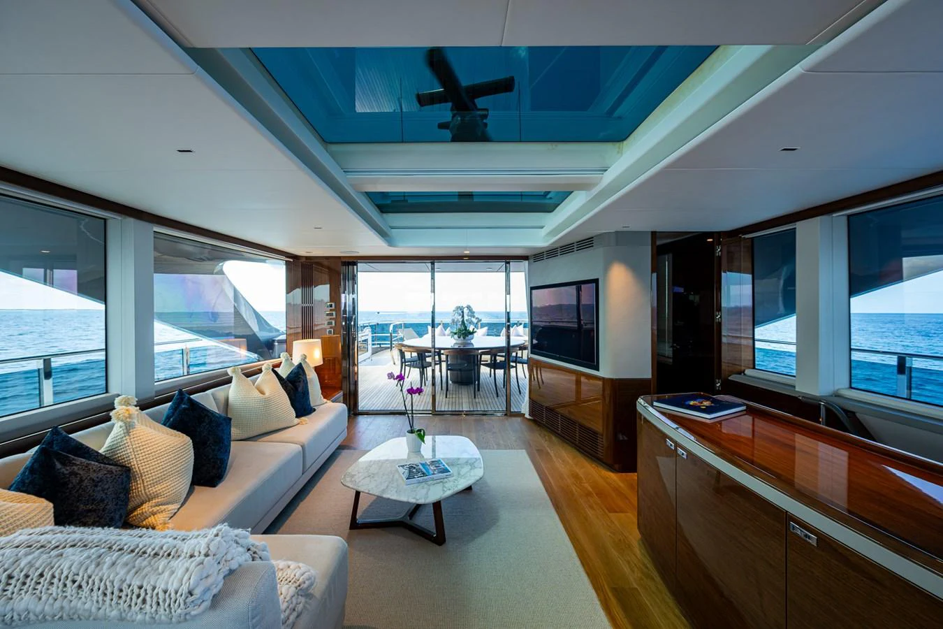 a living room with a large window aboard SPLASH Yacht for Sale