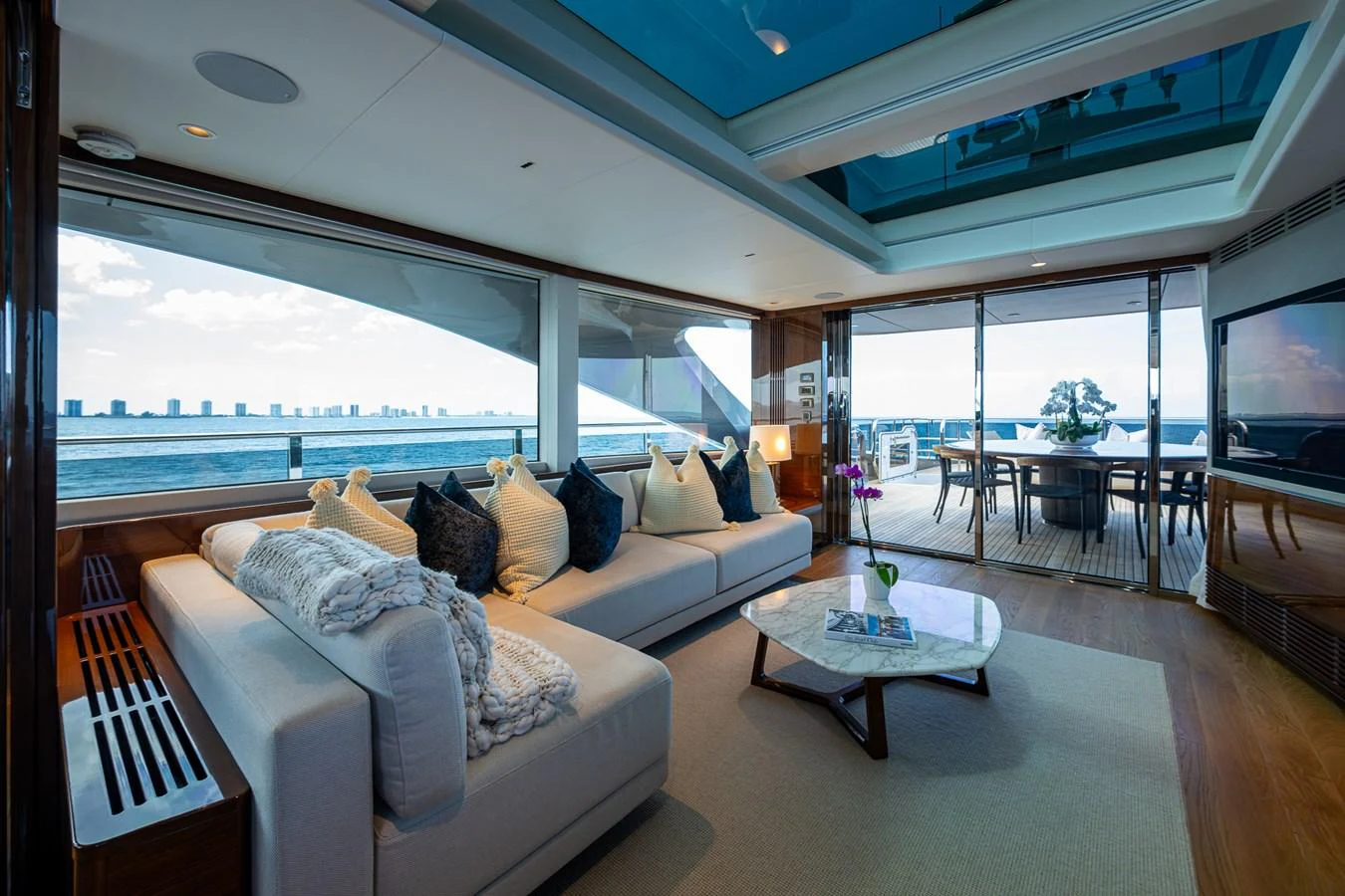 a living room with a large window aboard SPLASH Yacht for Sale