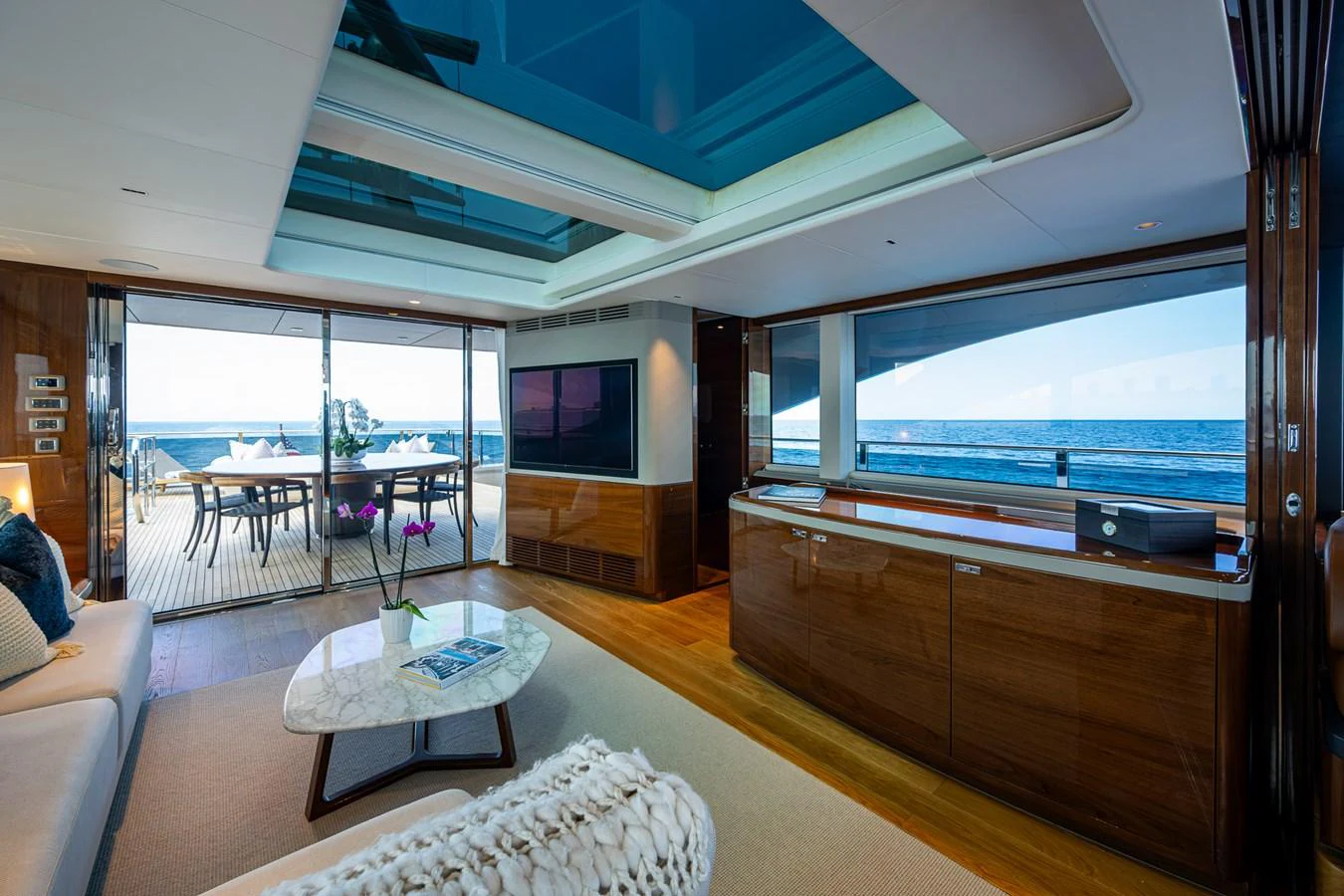 a living room with a large window aboard SPLASH Yacht for Sale