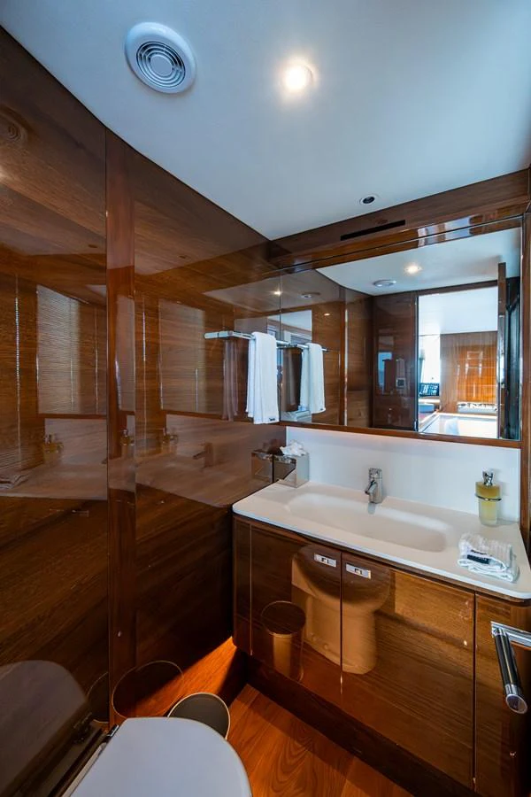 a bathroom with wooden walls aboard SPLASH Yacht for Sale