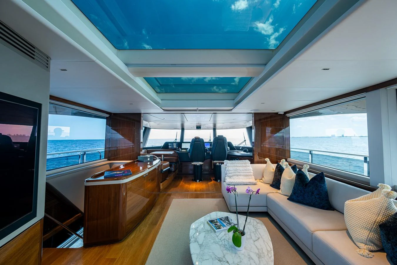 a room with a couch and a tv aboard SPLASH Yacht for Sale