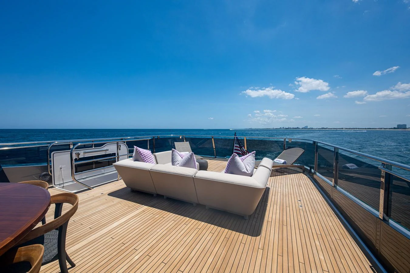 a deck with a view of the ocean and the ocean aboard SPLASH Yacht for Sale