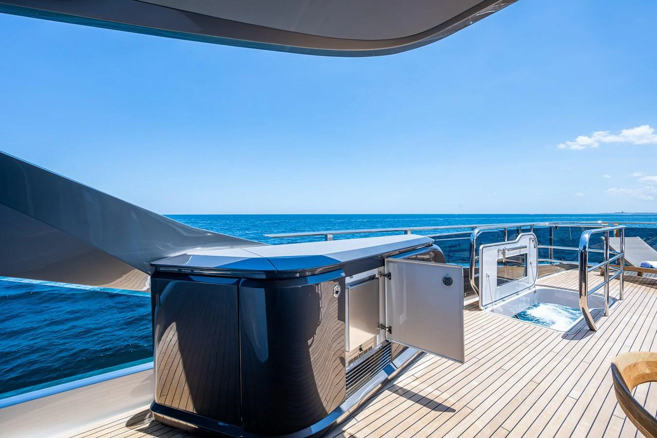 a deck with a large container on it and a large body of water in the background aboard SPLASH Yacht for Sale