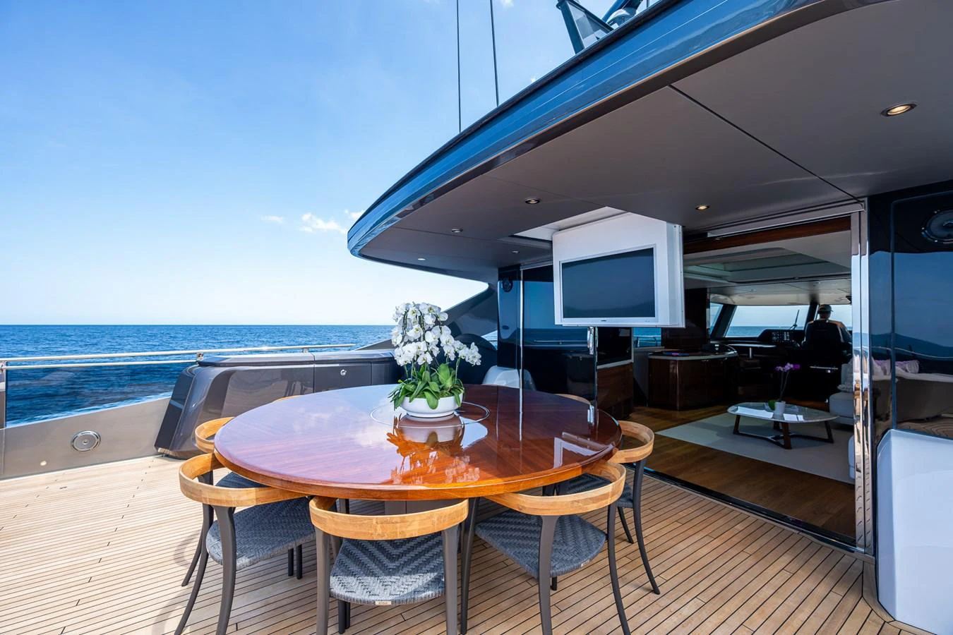 a table and chairs on a deck aboard SPLASH Yacht for Sale