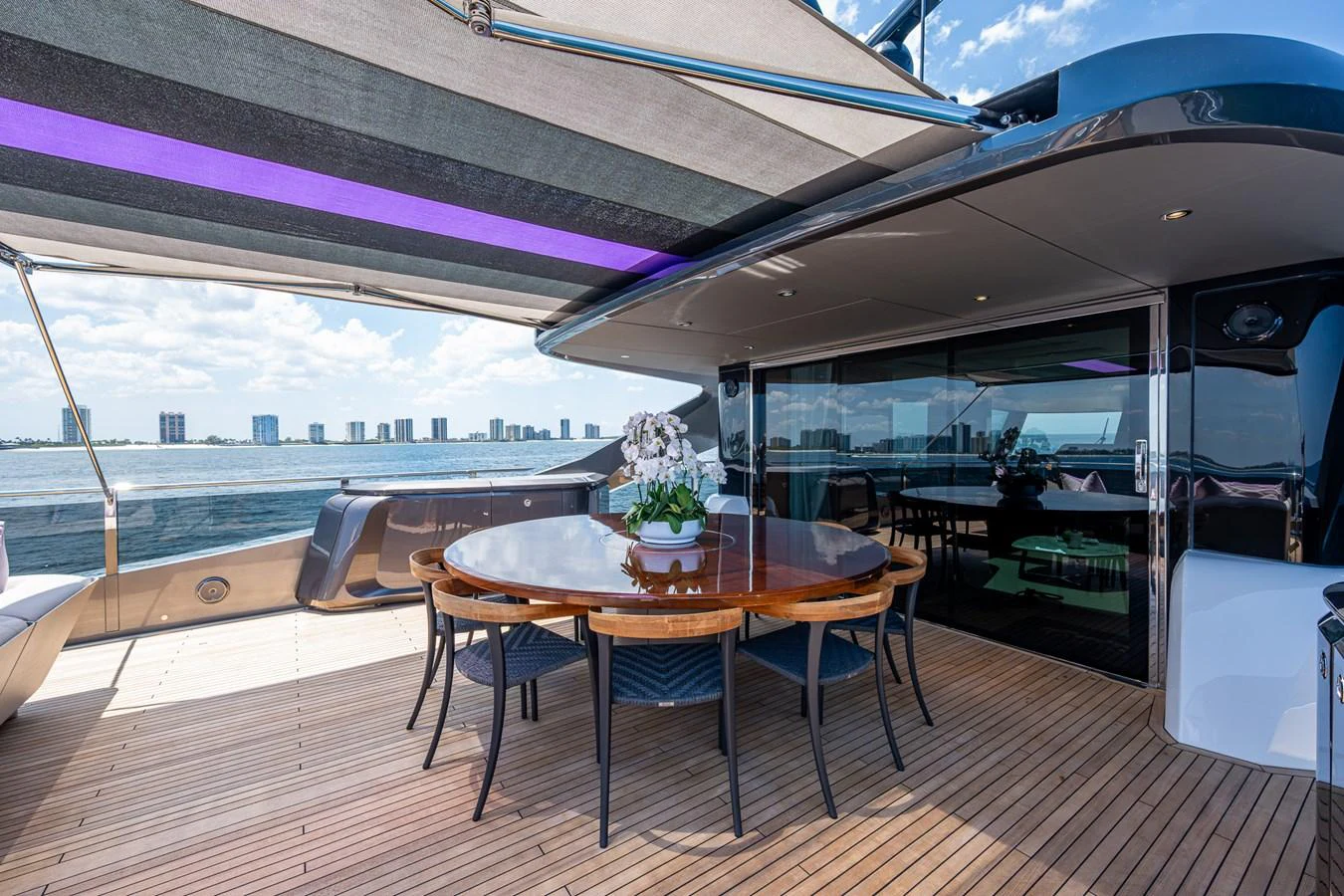 a table on a deck aboard SPLASH Yacht for Sale